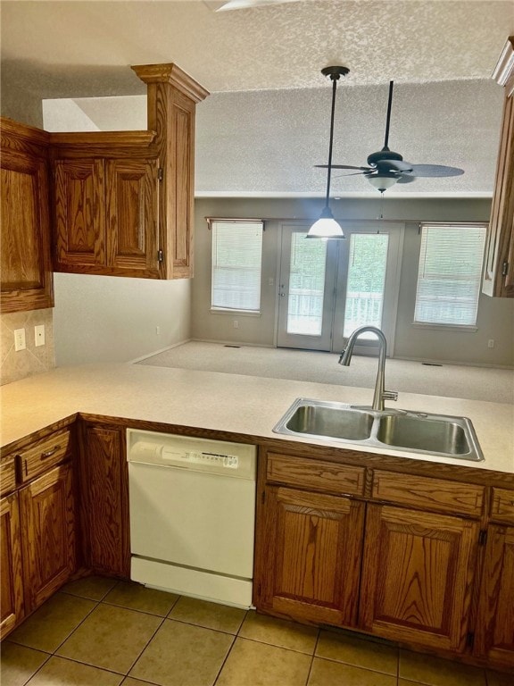 37 Retford Dr, Bella Vista, AR 72715 - kitchen with dishwasher, a sink, healthy amount of natural light, ceiling fan, and a textured ceiling