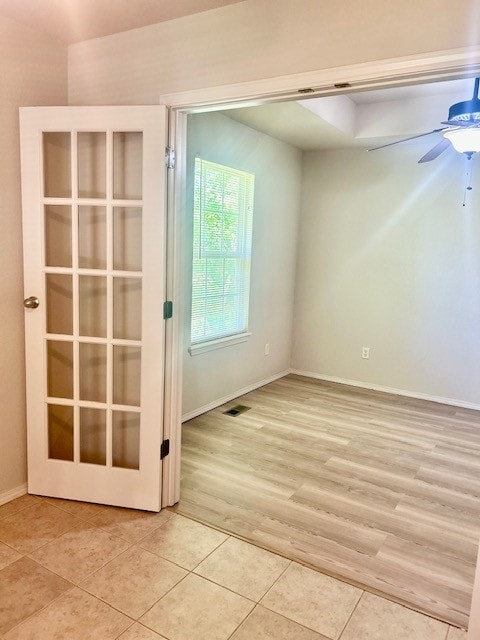 37 Retford Dr, Bella Vista, AR 72715 - spare room with light tile patterned floors, baseboards, and a ceiling fan