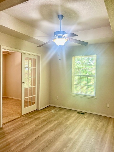 37 Retford Dr, Bella Vista, AR 72715 - spare room with wood finished floors, ceiling fan, baseboards, and a textured ceiling