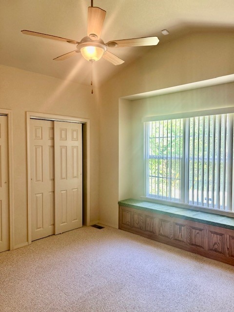 37 Retford Dr, Bella Vista, AR 72715 - unfurnished bedroom featuring vaulted ceiling, carpet, and ceiling fan