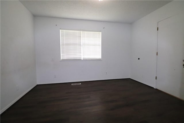 3064 Brandy Ln, Springdale, AR 72762 - spare room featuring wood finished floors, baseboards, and a textured ceiling