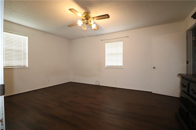 3064 Brandy Ln, Springdale, AR 72762 - spare room with dark wood finished floors, a ceiling fan, and a textured ceiling