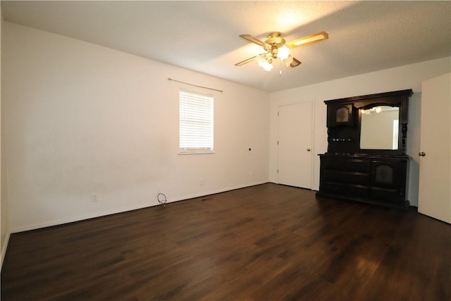 3064 Brandy Ln, Springdale, AR 72762 - empty room with dark wood-style floors, ceiling fan, and baseboards
