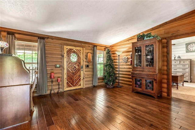 2895 County Road 116, Eureka Springs, AR 72631 - foyer with a textured ceiling, lofted ceiling, hardwood / wood-style flooring, and rustic walls