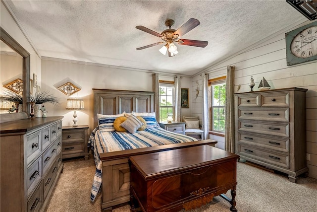 2895 County Road 116, Eureka Springs, AR 72631 - bedroom featuring vaulted ceiling, light carpet, a textured ceiling, ceiling fan, and wooden walls