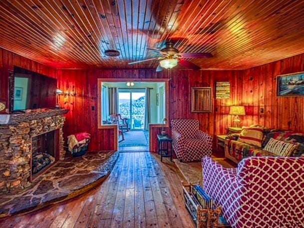 96NC6450 457 NC-6012, Jasper, AR 72641 - sitting room with hardwood / wood-style floors, wood ceiling, wood walls, a ceiling fan, and a fireplace