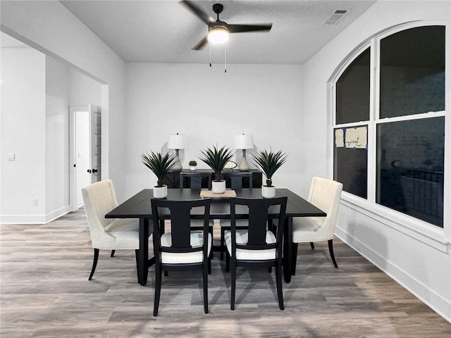 2822 N Grey Squirrel Dr, Fayetteville, AR 72704 - dining room featuring wood finished floors, ceiling fan, and baseboards