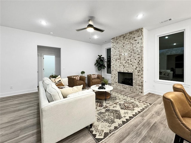 2822 N Grey Squirrel Dr, Fayetteville, AR 72704 - living room featuring ceiling fan, wood finished floors, a fireplace, baseboards, and recessed lighting