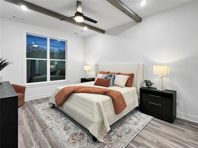 2822 N Grey Squirrel Dr, Fayetteville, AR 72704 - bedroom with beamed ceiling, wood finished floors, baseboards, and a ceiling fan
