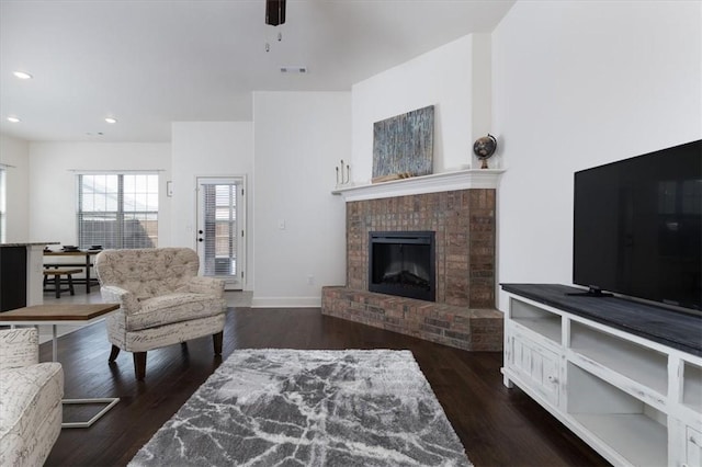 600 Gala Cir, Bentonville, AR 72712 - living room with recessed lighting, wood finished floors, a brick fireplace, and baseboards