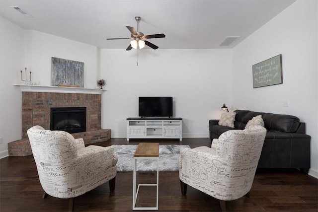 600 Gala Cir, Bentonville, AR 72712 - living area featuring a ceiling fan, baseboards, wood finished floors, and a brick fireplace