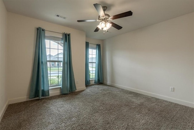 600 Gala Cir, Bentonville, AR 72712 - spare room featuring ceiling fan, carpet flooring, and baseboards