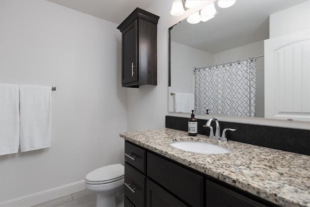 600 Gala Cir, Bentonville, AR 72712 - bathroom with vanity, toilet, and baseboards