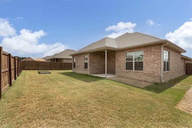600 Gala Cir, Bentonville, AR 72712 - rear view of property featuring brick siding, a patio, and roof with shingles