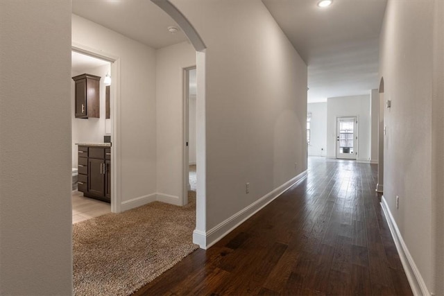 600 Gala Cir, Bentonville, AR 72712 - hallway with arched walkways, hardwood / wood-style floors, and baseboards