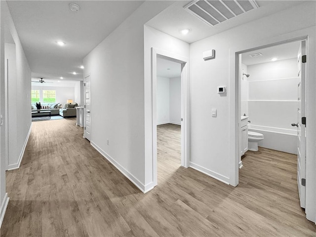 1661 Ridgeview Dr, Springdale, AR 72762 - hall with wood finished floors, baseboards, and recessed lighting