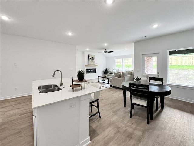 1661 Ridgeview Dr, Springdale, AR 72762 - kitchen with a sink, light wood finished floors, light countertops, recessed lighting, and a ceiling fan