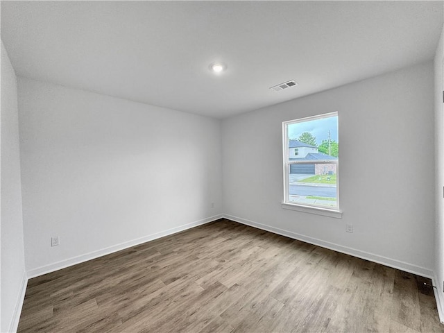 1661 Ridgeview Dr, Springdale, AR 72762 - spare room featuring dark wood-type flooring and baseboards