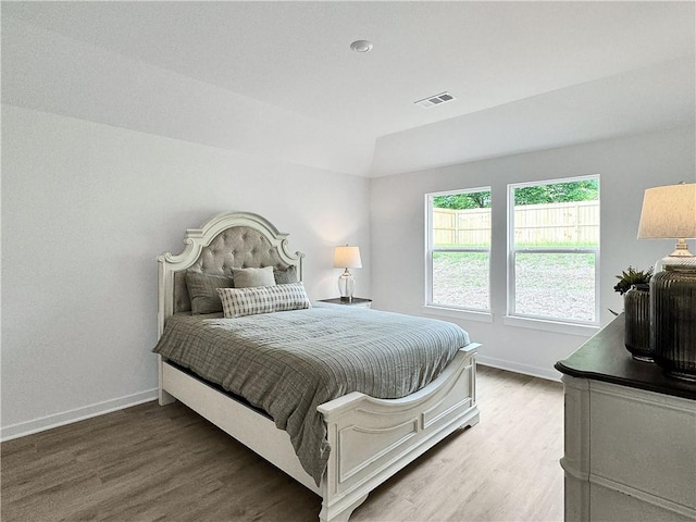 1661 Ridgeview Dr, Springdale, AR 72762 - bedroom with baseboards, wood finished floors, and vaulted ceiling