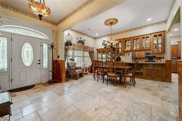 947 Cemetery Rd, Alma, AR 72921 - dining area with stone tile flooring, a towering ceiling, a chandelier, and recessed lighting