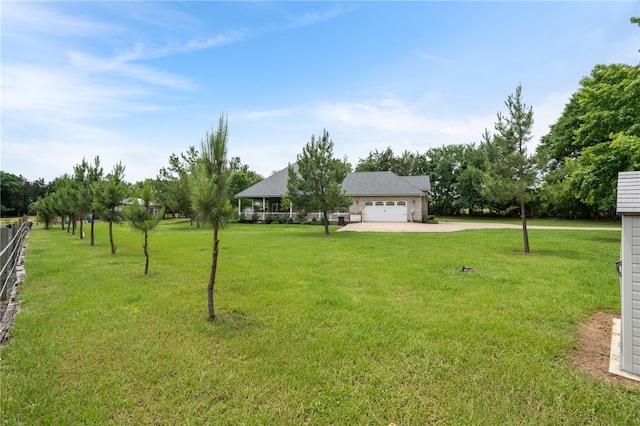 947 Cemetery Rd, Alma, AR 72921 - view of grassy yard featuring dirt driveway and an attached garage