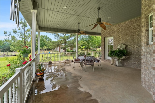 947 Cemetery Rd, Alma, AR 72921 - view of patio / terrace with outdoor dining area, ceiling fan, and a water view