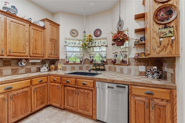 947 Cemetery Rd, Alma, AR 72921 - kitchen featuring dishwasher, a sink, brown cabinets, open shelves, and decorative backsplash