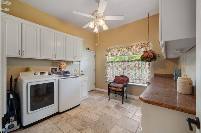 947 Cemetery Rd, Alma, AR 72921 - washroom featuring cabinet space, washer and dryer, a ceiling fan, stone tile floors, and baseboards
