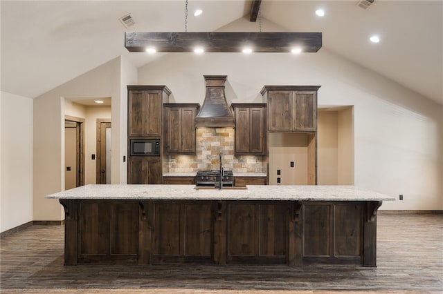 480124 E 1082nd Rd, Muldrow, OK 74948 - kitchen featuring custom exhaust hood, black microwave, a spacious island, dark wood finished floors, and a sink