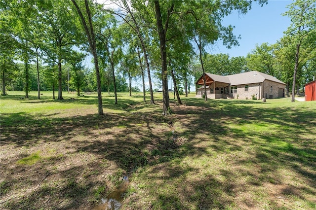 480124 E 1082nd Rd, Muldrow, OK 74948 - view of grassy yard featuring a garage