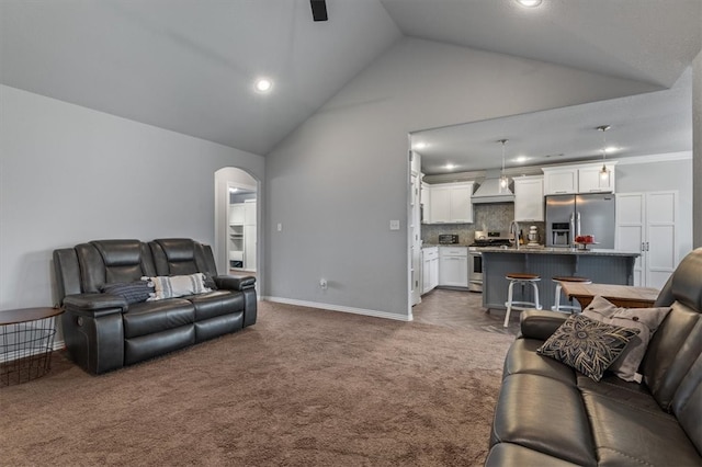 809 Dollar St, Cave Springs, AR 72718 - living area featuring carpet, lofted ceiling, arched walkways, baseboards, and recessed lighting