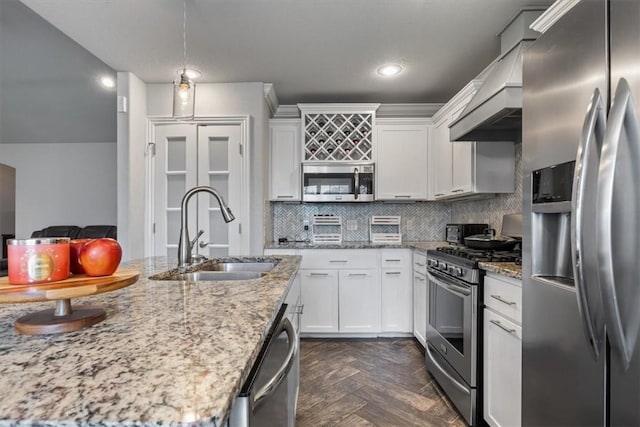 809 Dollar St, Cave Springs, AR 72718 - kitchen with stainless steel appliances, a sink, white cabinets, backsplash, and light stone counters