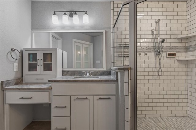 809 Dollar St, Cave Springs, AR 72718 - bathroom featuring a stall shower, vanity, and a textured wall