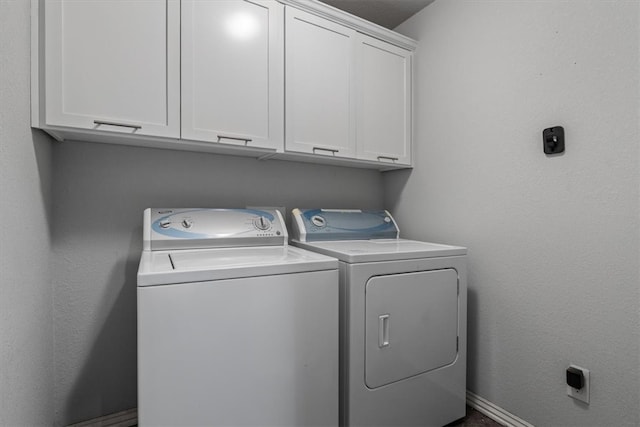 809 Dollar St, Cave Springs, AR 72718 - laundry room with cabinet space, washing machine and clothes dryer, and baseboards