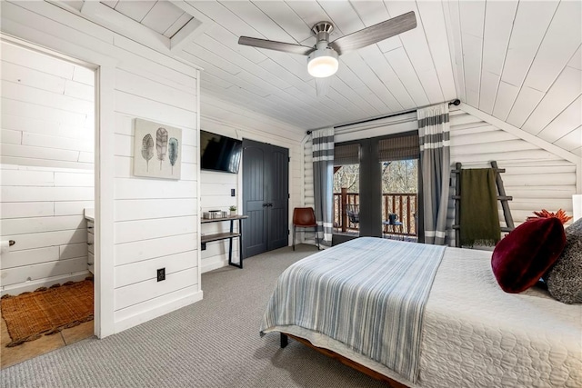 22283 N Log Cabin Dr, Sulphur Springs, AR 72768 - carpeted bedroom with wooden walls, lofted ceiling, wooden ceiling, french doors, and ceiling fan