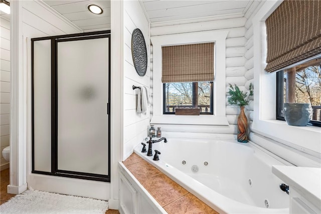 22283 N Log Cabin Dr, Sulphur Springs, AR 72768 - bathroom featuring healthy amount of natural light, a stall shower, a tub with jets, and toilet
