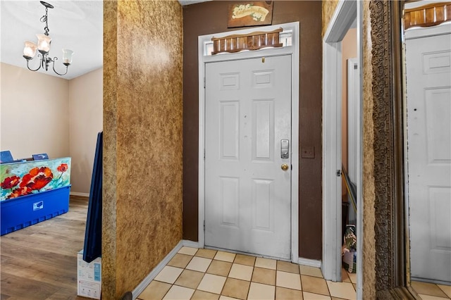 658 Walnut Ridge St, Centerton, AR 72719 - foyer entrance with a chandelier and baseboards