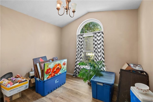 658 Walnut Ridge St, Centerton, AR 72719 - playroom with a chandelier, wood finished floors, lofted ceiling, and baseboards
