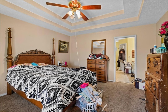 658 Walnut Ridge St, Centerton, AR 72719 - bedroom featuring carpet flooring, a tray ceiling, baseboards, and a ceiling fan