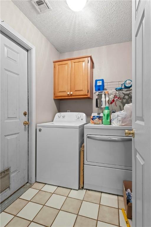 658 Walnut Ridge St, Centerton, AR 72719 - washroom with washer and dryer, a textured ceiling, cabinet space, and light flooring