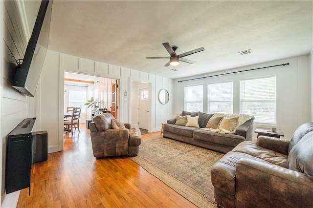 20608 Keck Rd, Siloam Springs, AR 72761 - living room with ceiling fan, wood finished floors, and healthy amount of natural light