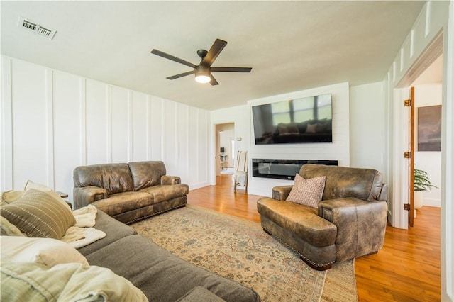 20608 Keck Rd, Siloam Springs, AR 72761 - living area featuring ceiling fan, wood finished floors, and baseboards