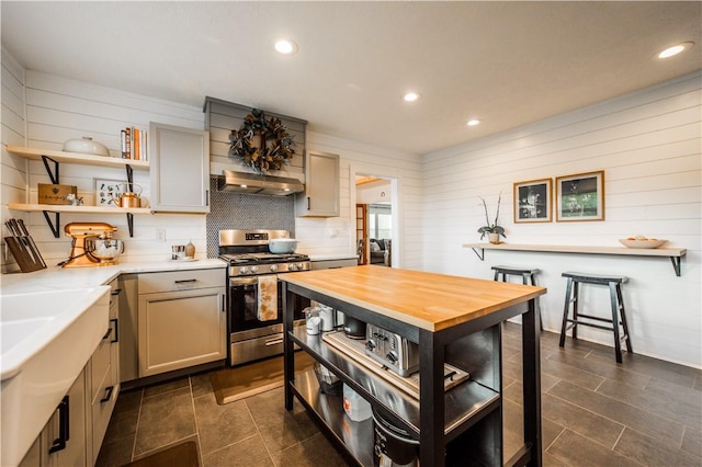 20608 Keck Rd, Siloam Springs, AR 72761 - kitchen with stainless steel range with gas stovetop, open shelves, recessed lighting, under cabinet range hood, and dark tile patterned floors