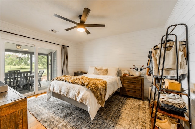 20608 Keck Rd, Siloam Springs, AR 72761 - bedroom with access to outside, wood walls, wood finished floors, ceiling fan, and ornamental molding