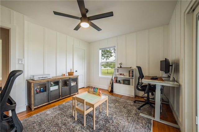 20608 Keck Rd, Siloam Springs, AR 72761 - office area with a decorative wall, a ceiling fan, and wood finished floors