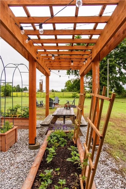 20608 Keck Rd, Siloam Springs, AR 72761 - view of patio / terrace featuring a pergola and a garden