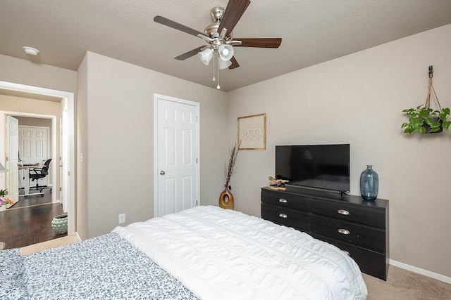 6108 SW Warrington Rd, Bentonville, AR 72713 - bedroom featuring baseboards, a ceiling fan, and light colored carpet