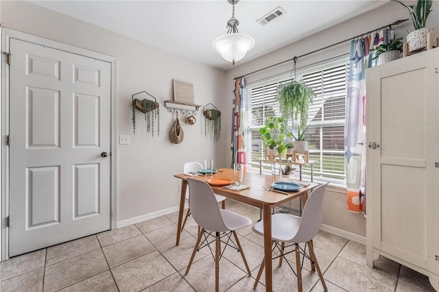 1308 E Freedom St, Siloam Springs, AR 72761 - dining room featuring baseboards and light tile patterned floors