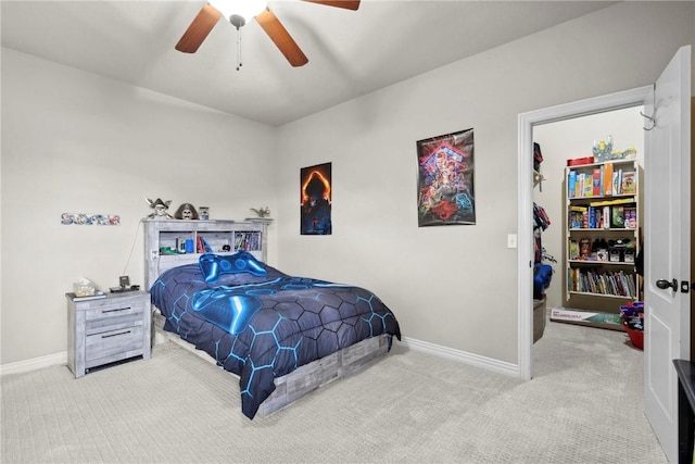 6401 S 42nd St, Rogers, AR 72758 - carpeted bedroom with baseboards, ceiling fan, and a walk in closet