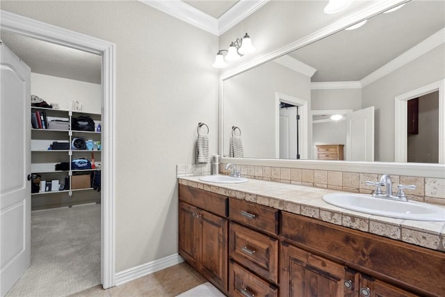 6401 S 42nd St, Rogers, AR 72758 - bathroom with double vanity, crown molding, a walk in closet, and baseboards